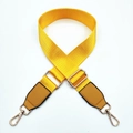 Close-up of adjustable bright yellow nylon bag strap with gold metal hooks and leather - Yellow / Gold Buckle