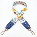 Detail of adjustable floral woven strap with blue leather ends and gold metal clasps - White & Yellow Flowers + Lake Blue Leather