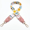 Adjustable floral bag strap with orange flowers and gold metal swivel hooks detail - White Yellow Flower + Pink Leather