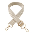 Close-up of beige geometric checkered woven strap with polished gold metal buckles - Gold Buckle / Beige and White Checkered