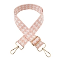Detailed view of pink houndstooth wide strap with shiny gold swivel hooks and buckle - Pink