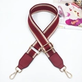 Detail of adjustable woven purse strap with geometric pattern and gold-tone metal hooks - Burgundy