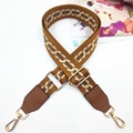 Detail of adjustable geometric strap with leather ends and golden swivel lobster hooks - Gold Buckle / Brown