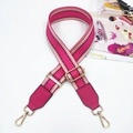 Detail of adjustable woven strap with pink leather ends and gold metal snap hooks - Rose Red