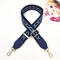 Close-up of navy blue wide guitar strap with geometric pattern and gold swivel hooks - Gold Buckle / Dark Blue/Light Blue Chain