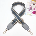 Detail of grey herringbone strap with golden metal hooks and adjustable buckle for bags - Light Gray