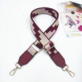Close-up of adjustable wide geometric shoulder strap with gold-tone swivel metal hooks - Ladder Grid Wine Red