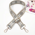 Detailed view of geometric ethnic style embroidery shoulder strap with gold metal buckle - Gold Buckle / Snowflake Grey