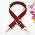 Detail of adjustable burgundy shoulder strap with gold hardware and beige piping edge - Gold Buckle / 4-Wine Red with Beige Edge