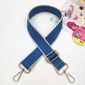 Detail of dark blue wide woven bag strap with golden metal hooks and adjustable buckle - Lake Blue With Rice Edges