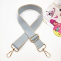 Detail of adjustable wide woven shoulder strap in grey-blue with golden metal swivel hooks - Pale Blue