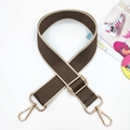 Close-up of brown and beige wide adjustable shoulder strap with gold metal buckle hardware - Dark Khaki and Beige Edge