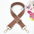 Detail of wide brown woven bag strap with beige edges and gold-tone adjustable hardware - Bean Sand Brown With Rice Edges