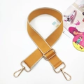 Close-up of bright yellow woven adjustable bag strap with light gold metal hardware - Yellow Beige