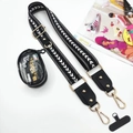 Close-up of black patterned phone strap with gold hooks and a clear mini coin pouch - White Arrow Strap + Transparent Pouch + Gasket