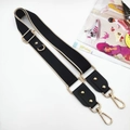 Close-up of adjustable black crossbody phone strap with gold hardware and beige woven edges - Black & Beige Edge Strap