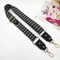 Close-up of adjustable houndstooth shoulder strap with gold hardware and leather ends - Houndstooth Strap / Silver Clasp