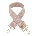 Detail of pink and beige geometric embroidery on a bag strap with gold metal hardware - Pink