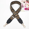 Detail of bohemian floral embroidery on wide woven bag strap with gold metal hooks - Gold Buckle / Black Brown + Black Leather