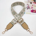 Close-up of ethnic style embroidered bag strap with golden metal hooks and hardware - Gold Buckle / Matcha Green and Khaki