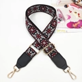 Detail of bohemian geometric woven bag strap with golden metal swivel hooks and buckles - Gunmetal Buckle / Wine Red + Black