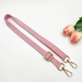 Detail of adjustable pink nylon strap with polished gold-tone metal buckles and hooks - Gold Buckle / Pink