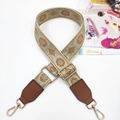 Close-up of ethnic jacquard purse strap with orange embroidery and gold metal hooks - Gunmetal Buckle / Brown Green And Brown