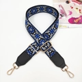 Close-up of floral embroidery on ethnic style bag strap with gold metal buckles - Gold Buckle / Royal Blue + Black