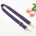 Detail of adjustable purple canvas bag strap with light gold metal lobster clasps - Deep purple