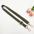 Detail of adjustable olive green cotton strap with golden metal lobster clasps and hardware - 17-Army Green