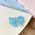 Macro shot of blue sequin bow phone grip with heart glitter and resin texture - Blue Sugar Heart (Large Bow Stand)