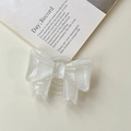Close-up of a white glittery bow phone grip holder with a semi-transparent finish - Large Bow Stand - Cloud Flash White