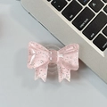 Close-up of pink glitter bow phone socket with translucent resin and silver sparkles - Large Bow Grip-Dot Glitter-Light Pink