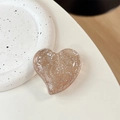 Macro view of transparent glitter heart phone grip with sparkling silver sequins - Large Crooked Heart - Glitter Dots / Transparent Brown