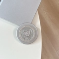 Detail of silver MagSafe phone grip with sparkling rhinestones and heart motif - Rhinestone Pearl Bandage Heart / Silver