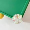 Close-up of cute bowknot phone grip with heart sequins and green butterfly charm - Green Butterfly
