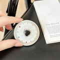 Macro shot of magnetic phone grip with black heart gem and multicolored rhinestones - Matte Silver Magnetic - Sweetheart / Black