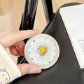 Macro shot of magnetic phone holder with yellow heart gemstone and colorful rhinestones - Matte Silver Magnetic - Sweetheart / Yellow
