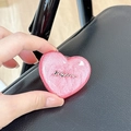 Close-up of glittery heart phone grip with Luckyhorse metallic text detail - Stereo Heart - Red Glitter / Adhesive Stand Style