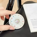 Macro shot of heart-shaped crystal phone grip with multi-colored rhinestone border - Matte Silver Magnetic - Sweetheart / Iridescent