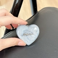 Detail of blue heart-shaped MagSafe phone grip with silver glitter and luckyhorse text - Stereo Heart - Silver Gray / Adhesive Stand Style