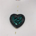 Detail of heart-shaped phone ring holder with dark green crystals and black nickel base - Heart Ring / Green