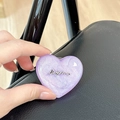 Detail of purple glitter heart phone stand with silver Luckyhorse metal lettering - Stereo Heart - Purple Glitter / Adhesive Stand Style