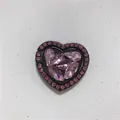 Macro shot of heart-shaped phone ring holder with pink rhinestones on black metal base - Heart Ring / Pink