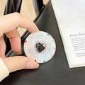 Close-up of magnetic telescopic phone grip featuring a black heart gem with rhinestones - Transparent Stand - Sweetheart / Black