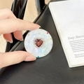 Macro detail of magnetic telescopic phone stand with red heart gem and colorful rhinestones - Transparent Stand - Sweetheart / Burgundy