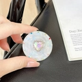Detail of magnetic heart rhinestone phone grip with colorful gems and pearlescent base - Transparent Stand - Sweetheart / Iridescent