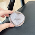 Detail view of a lavender heart-shaped MagSafe phone grip with glitter and bead edges - Stereo Heart - Brown Glitter / Pearl Magnetic Style