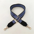 Detail of adjustable woven striped bag strap with gold metal hardware and lobster clasps - Lake Blue Striped + Black Leather