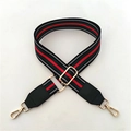 Detail of red and green striped crossbody strap with gold metal hooks and leather tips - Green Striped Black Edge + Green Leather